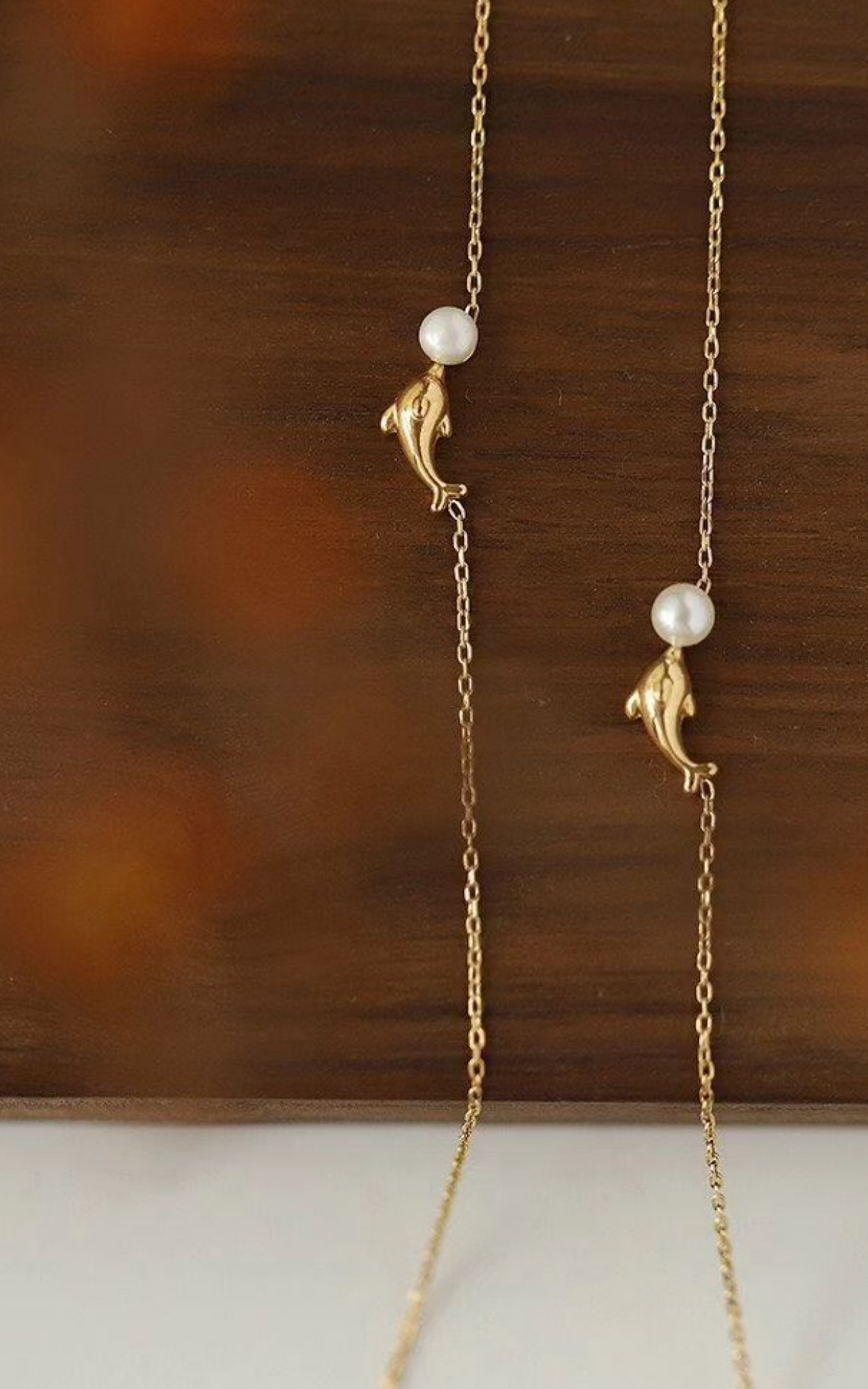 Collier de perles dauphin