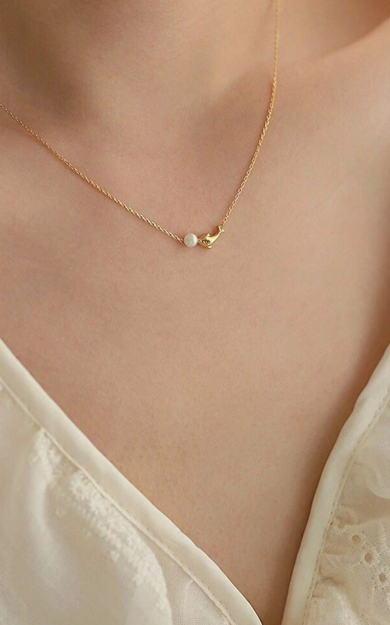 Collier de perles dauphin
