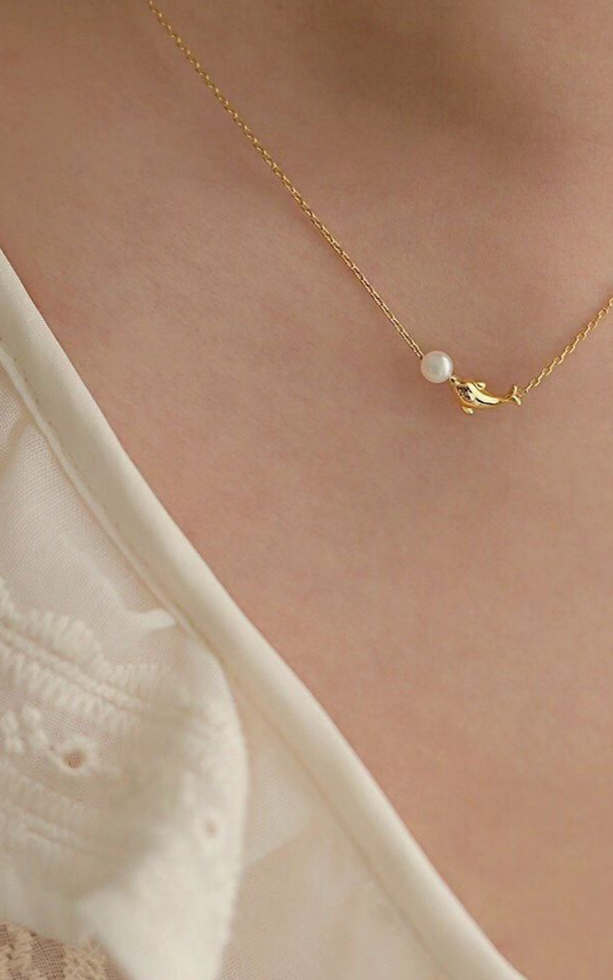 Collier de perles dauphin