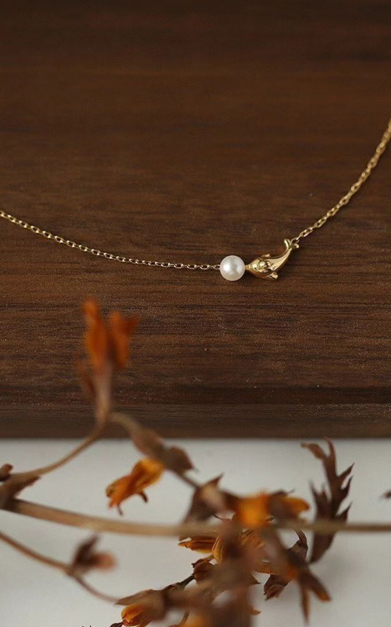 Collier de perles dauphin