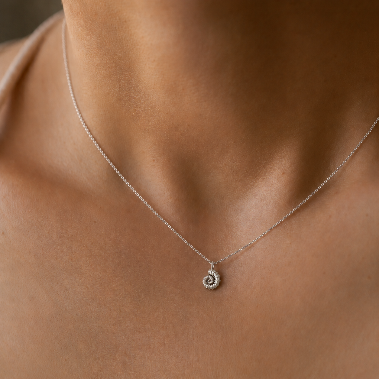 Pendentif coquillage en spirale